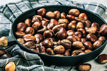Roasted chestnuts served on an old table