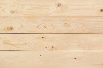 Freshly-planed wood planks closeup