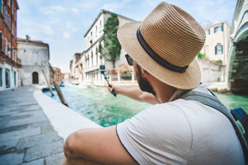 Male travel blogger spending vacations in Venice, Italy
