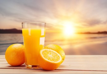 Close-up of fresh tasty orange juice in glass on table