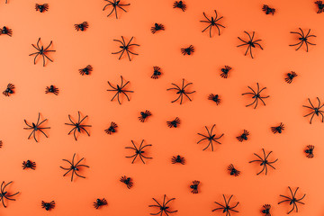 Halloween concept. Decorations on the orange background. Flat lay, top view, copy space