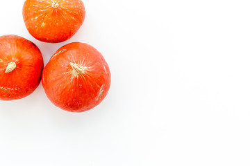 Bright autumn pumpkins on white background top view copy space