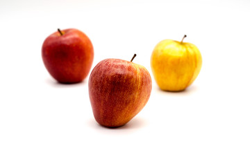 Fototapeta na wymiar three apples at differing depths