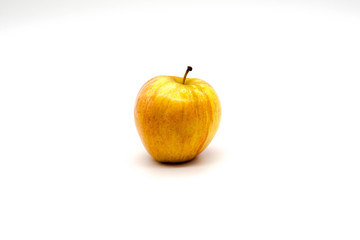 centered and isolated yellow apple on a white background