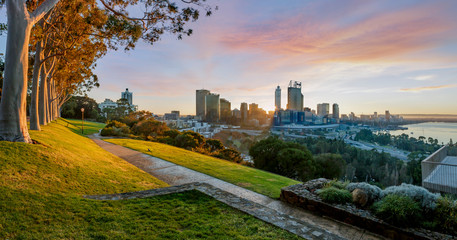 Cityscape of Perth Western Australia as the sun rises. The photo was taken in Kings Park