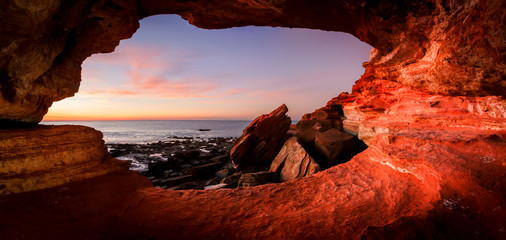 Looking out from a small cave at  Gantheaume Point  Broome  Western Australia at sunset © Bruce Aspley