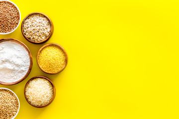 Cereals collection on yellow background top view frame copy space