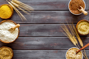 Cereals collection on dark wooden background top view frame copy space