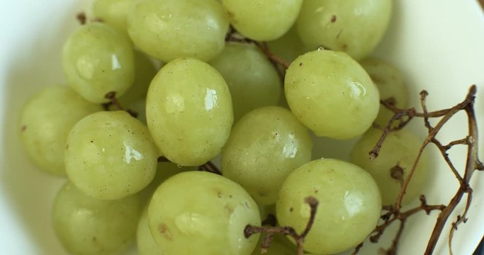 Vine fresh grapes rotating on a serving platter. Shot in 4K RAW on a cinema camera.