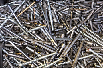 A background of a variety of drill bits.