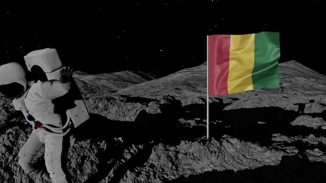 astronaut planting Guinea flag on the moon.