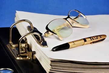 Folder with files-Registrar of archival records, glasses, pen.Folder stationery-belonging business...