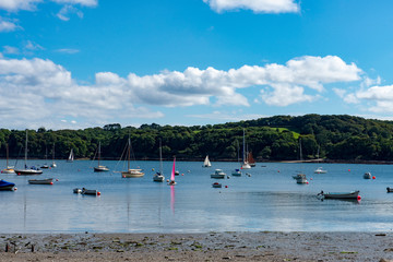 Fototapeta na wymiar View of small boats on the Helford River in Cornwall, UK