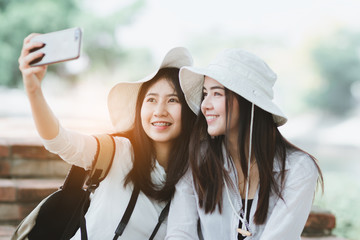 Asia  women travelling  together with fun and happy on holiday.