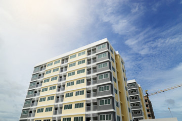 Fototapeta na wymiar Modern apartment building at blue sky
