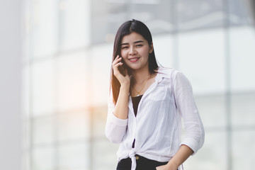 Fototapeta premium Asia woman using smartphone working,playing with happy.