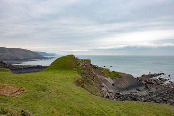 Fototapeta na wymiar View of the dramatic rocky coastline of North Devon, Uk near Hartland Quay