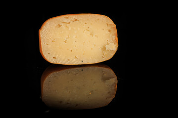 half of hard porous yellow cheese head with holes