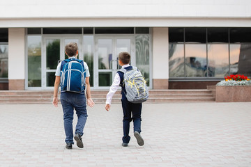 Two teenagers in school uniforms.