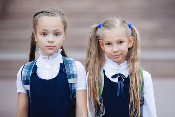 Two teenage schoolgirls in uniform.