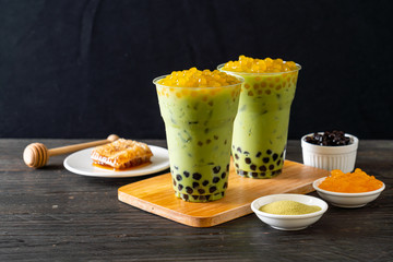 green tea latte with bubble and honey bubbles