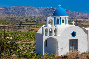 Vineyards and the Holy Trinity Church located in Akrotiri village on the Santorini Island © anamejia18