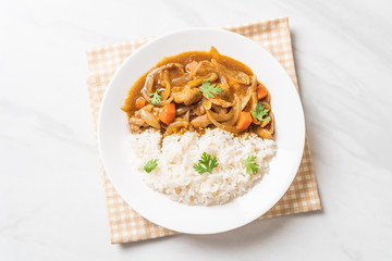 Japanese curry rice with sliced pork, carrot and onions