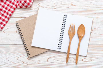 blank notebook for text note on wooden surface with copy sapce