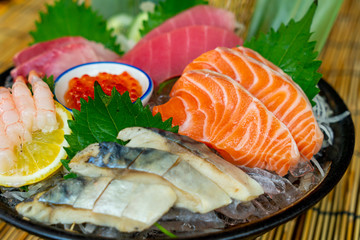 fresh salmon tuna and hamachi raw sashimi