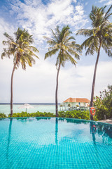 swimming pool with sea beach background in Maldives