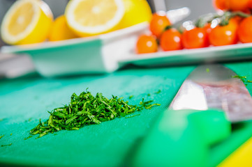 Male cook hands cutting greenery.Close up.
