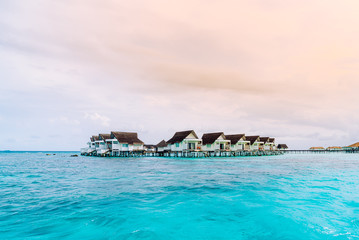 tropical Maldives resort hotel and island with beach and beautiful sky