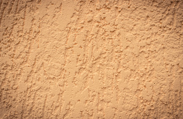 Orange cement and concrete wall as background texture, copy space for text