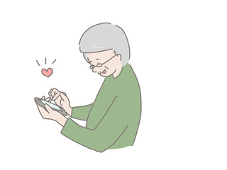 スマホを持った年配男性　いいね