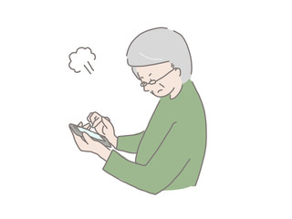 スマホを持った年配男性　怒る