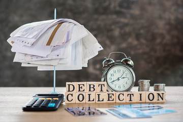 debt collection concept with unpaid bills,calculator,coin on desk 