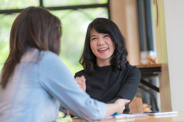 business woman working together with tablet at coffee shop
