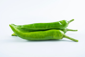 Fresh green green pepper on white background