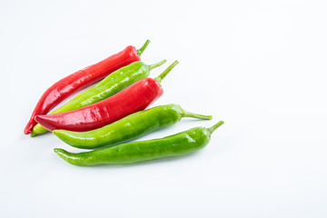 Fresh red pepper and green pepper on white background