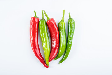 Fresh red pepper and green pepper on white background