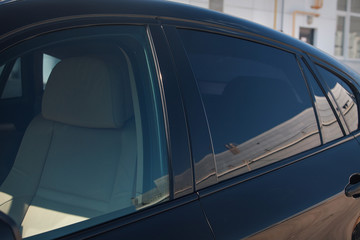 tinted black car Windows that reflect the glass ceiling © aaalll3110