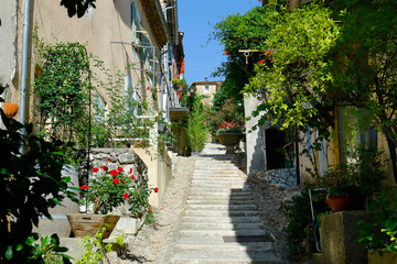 street  of mediterranean village with colorful shutter in the south of france,provence