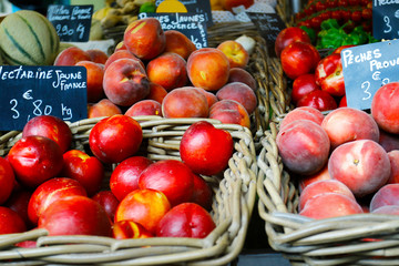 assortment of fruit  sold in market in provence,france-with text peach yellow from provence,nectarine yellow from france,melon france beaucaire in provence