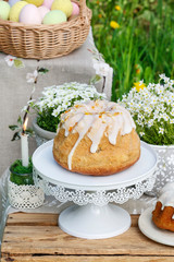 Easter cakes and flowers in the garden. Rustic decorations.