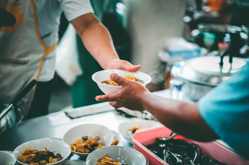 Philanthropists donate food and help the poor : concept of feeding