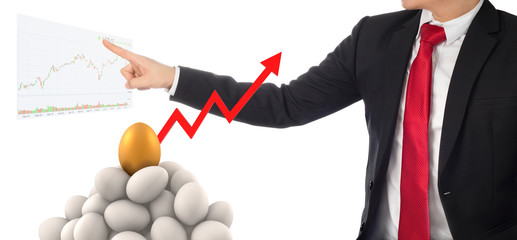 business man invest in gold egg , concept risk investment in trading asset