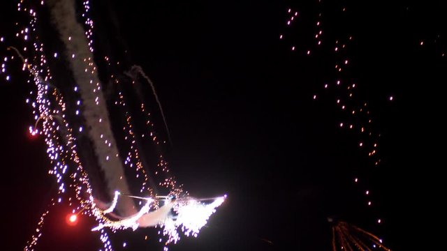 Airplanes Aerobatics at Night with Sparks and Fireworks Air Show Slow Motion
