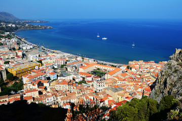 Naklejka premium Beautiful view of Cefalu town from the Rocca di Cefalu in the early morning. Sicily, Italy