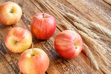 Apples close-up over the wooden natural background