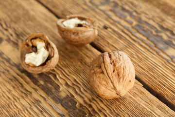Walnut close-up over the wooden natural background